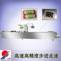 山东小康牌520型全自动连续拉伸膜真空包装机/鱼豆腐豆干真空包装机